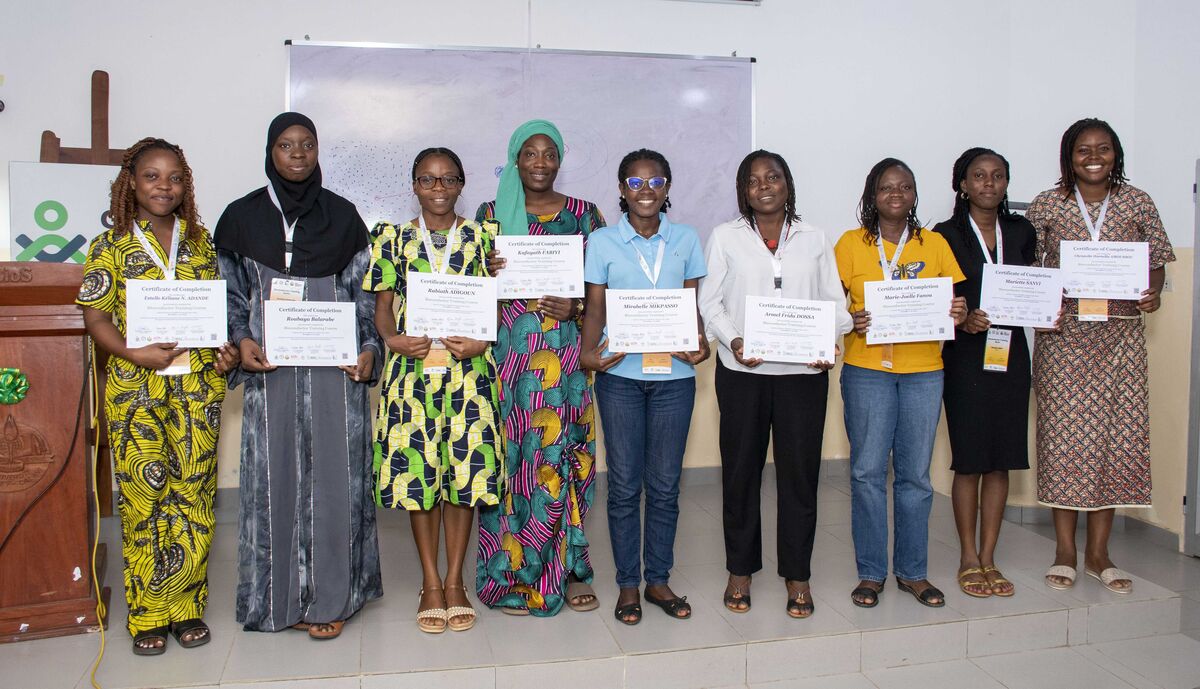 Female participants holding their certificates